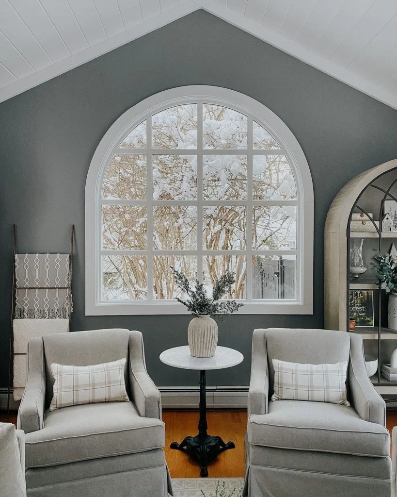 Large Arch Window Softens Charming Seating Area